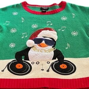 Ugly Christmas sweater with penguin Santa. Medium